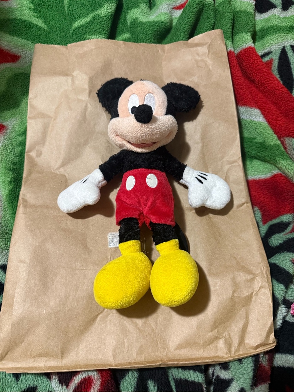 Classic Disney Mickey Mouse plush featuring his iconic red shorts, yellow shoes
